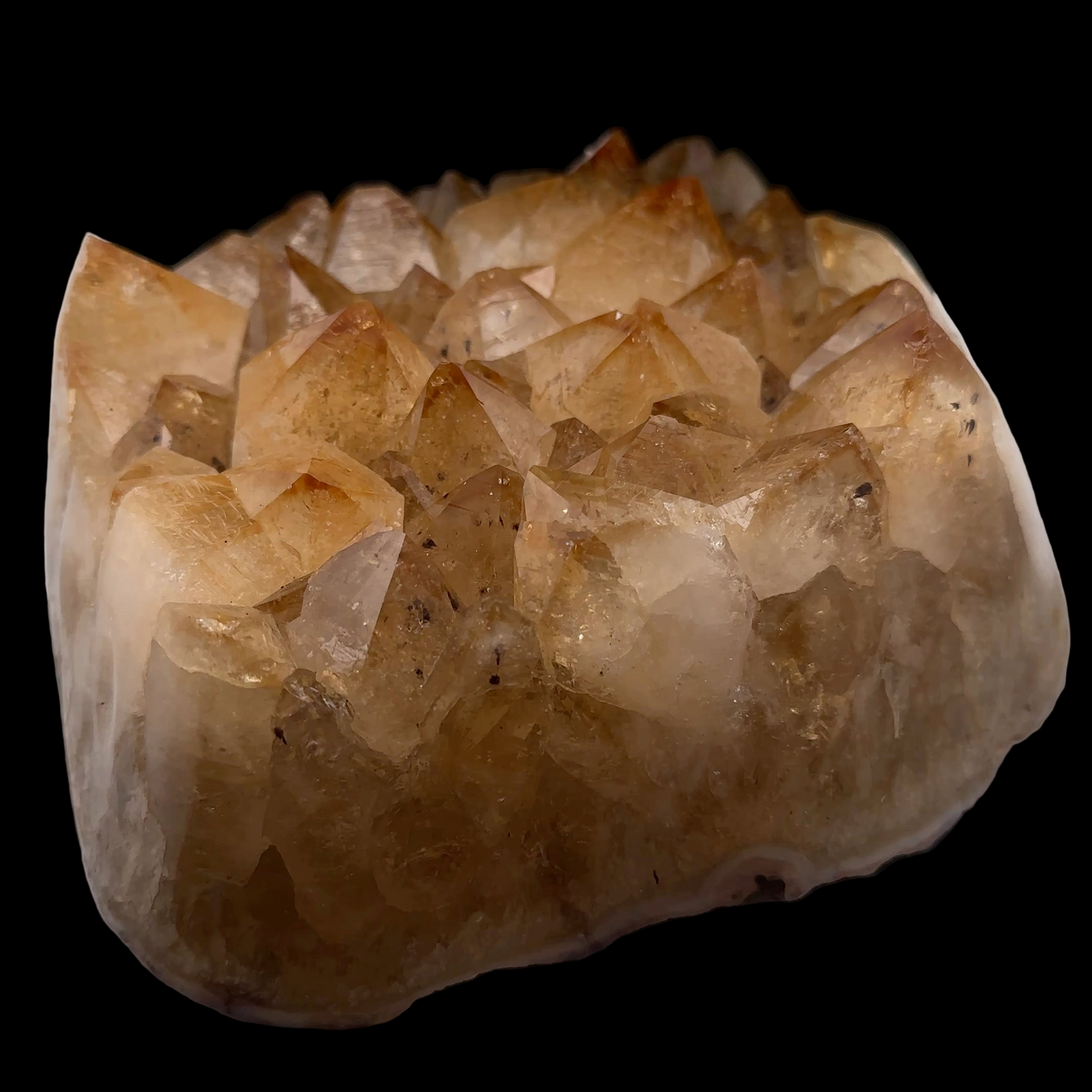 Crystal rock with visible crystals on a black background. Citrine Druze 2900 g 15 × 13 × 7 cm