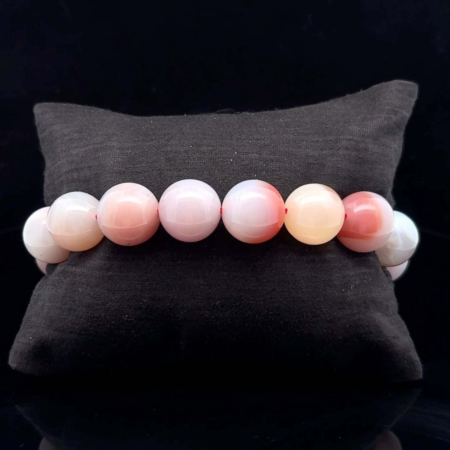 This bracelet features natural agate beads with distinctive stone patterns and natural mineral structure.