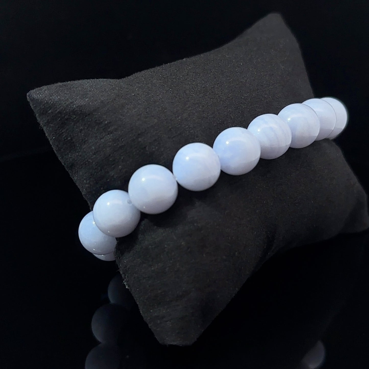 A bracelet with white and blue agate beads