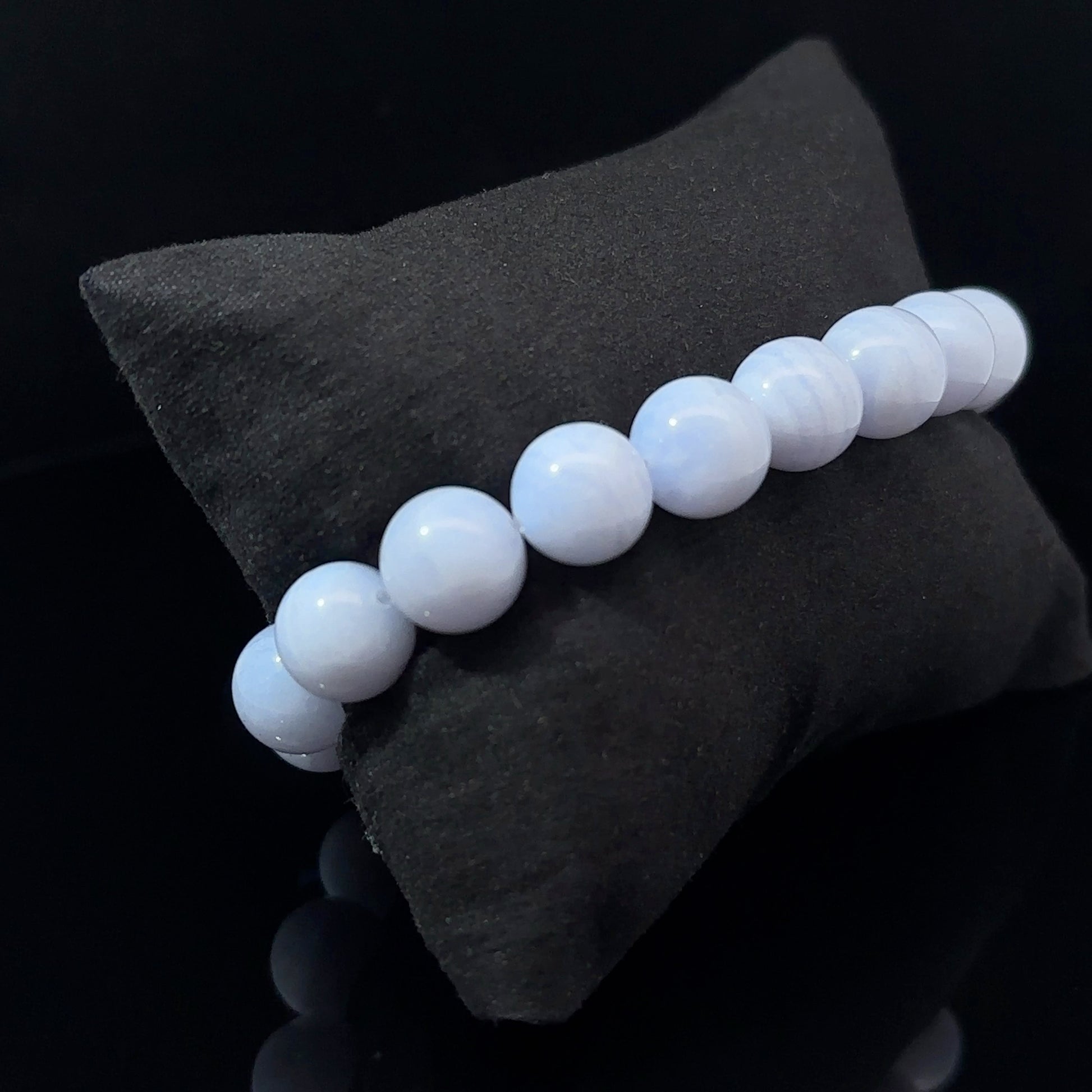 A bracelet with white and blue agate beads