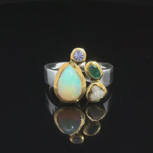 Загружайте и воспроизводите видео в средстве просмотра галереи Кольцо Опал благородный эфиопия, изумрад, алмаз, танзанит 18 размер; серебро 925
