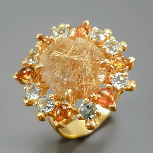 Kvarca gredzens ar rutilu, 15x13 mm, 7,7 g turmalīna, topāzs, 17,5 izmērs; 925. proves sudrabs.